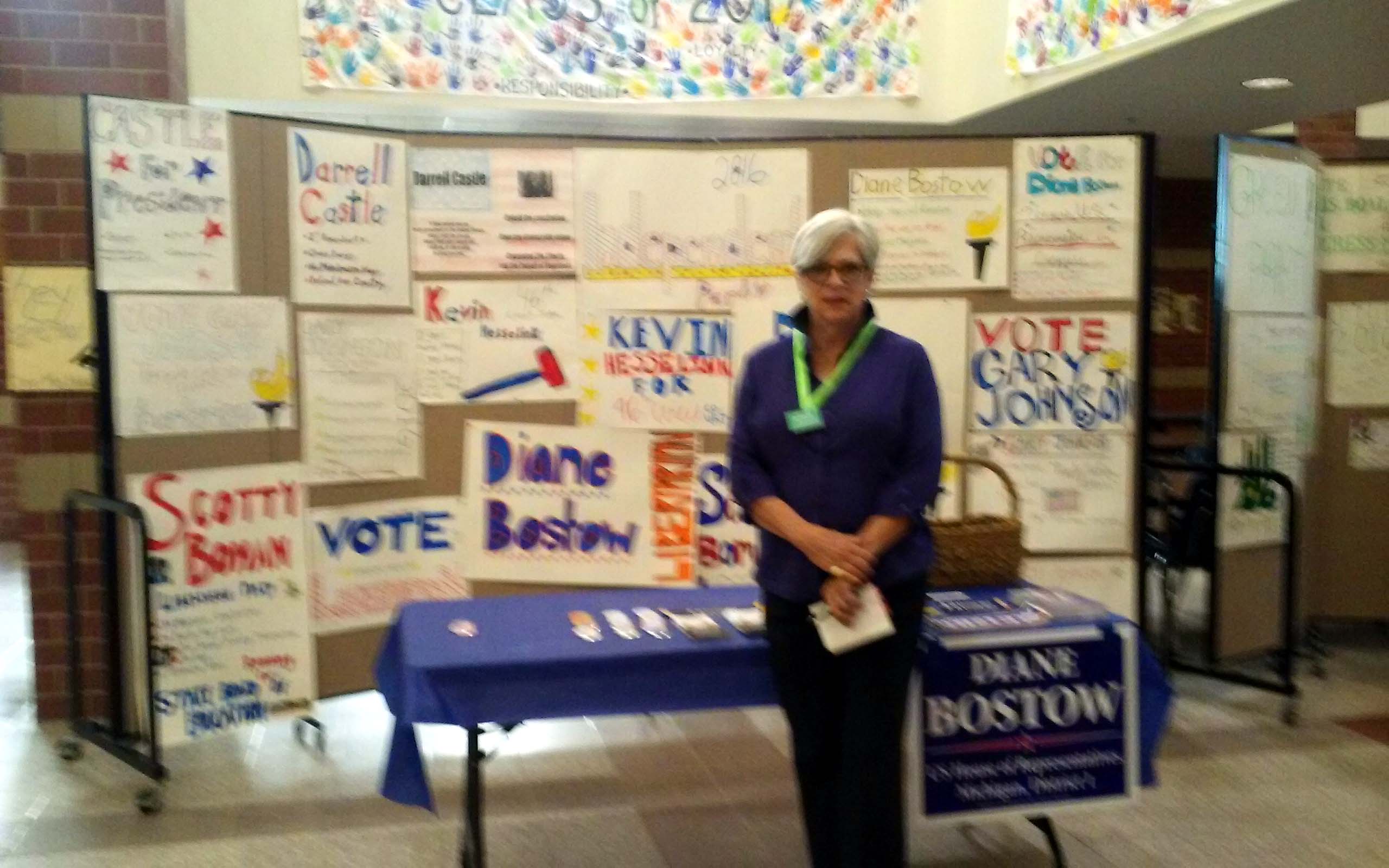 US House candidate Diane Bostow stands in student created display at Gaylord High School