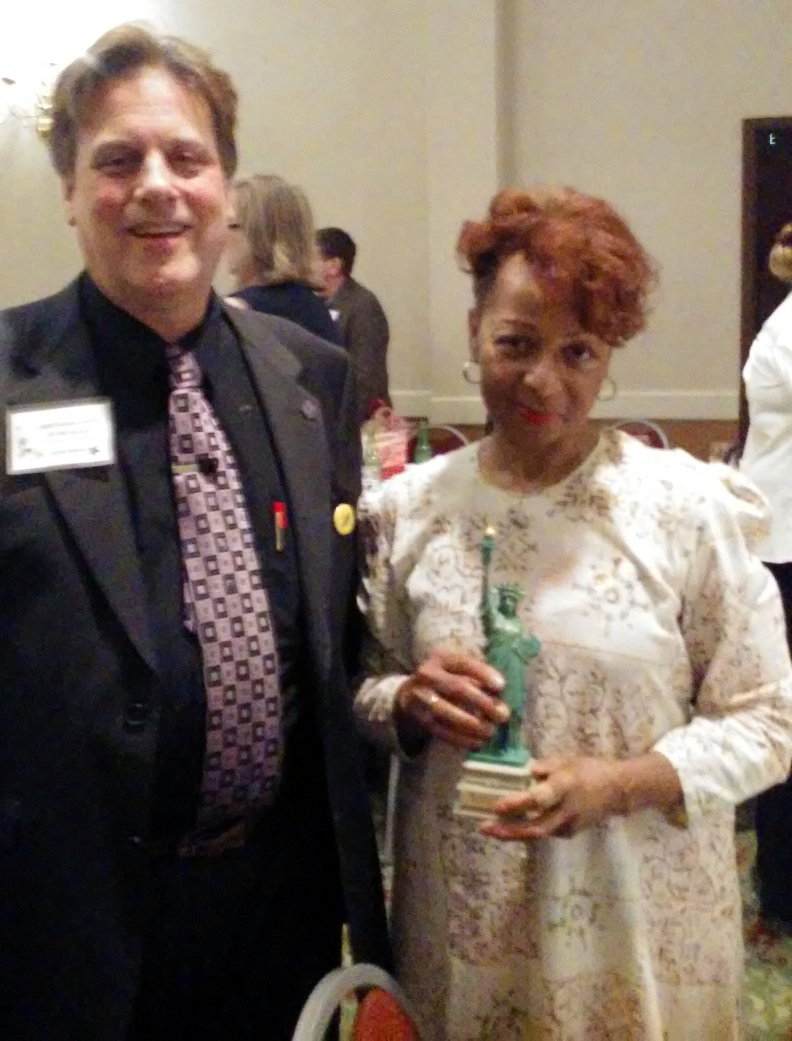 Penny Godboldo (Left) Proudly holds her sister's Libby while standing with nominator Scotty Boman (Right).